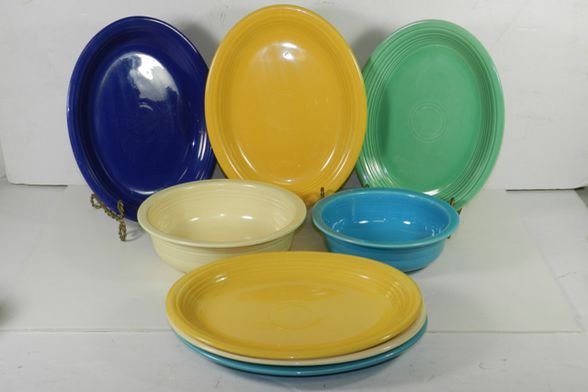 Lot of 8 Fiesta Platters & Bowls: Includes 6 Platters 12.5", 1 large bowl 8.5", 1 large veggie dish (hairline) 9.5". Condition: Normal use & wear on all but noted bowl.