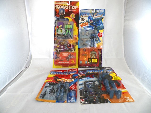 6- ROBOCOP ACTION FIGURES MOCs: Includes Orion Talking Robocop, Toy Island Ratta tat Robocop, Woosh Robocop, Kenner Robocop Ultra Police, Toy Island Commandant Cash, and Jet Cycle. Mint on Cards