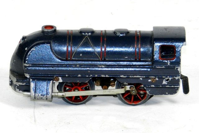 Pre War Cast Iron Electric Engine: Unmarked pre war cast iron electric engine measures 7" long including the connector. Moderate wear on paint. Bottom shows run-time wear. Red accent wires are attached but flaking.