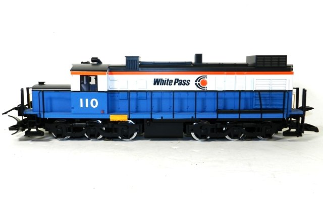 LGB 2055 White Pass and Yukon Locomotive: New in box, which has been signed "Happy LGBing! - Wolfgang Richter, 12-1-89". Richter was a co-creator of LGB Trains, and passed away in 2012. Original shipping box also included.