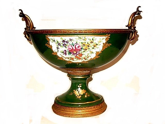 Sevres Bronze-Mounted Porcelain Center Bowl: Large Bronze ormolu mount Sevres oval center piece bowl having two inset panels similar in design. One side with basket of roses and flowers the other side with bouquet of flowers in gold scroll work,