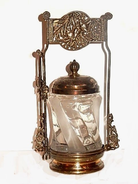 Victorian Silver-plate Pattern Glass Pickle Castor: Aesthetic Movement late 19th. C. silver-plate frame with tongs and three birds amongst leaves on top bridge plate. Unsigned Attributed to Pairpoint. With clear and frosted glass twisted design jar. Co