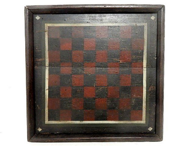19th. C. Primitive Folk Art Checker Board: Having a black and red board with white line border and white diamond shape logo in each corner. Condition good, crack across center, normal wear for age usage. 29" H x 30 1/2" L x 19 1/2" D