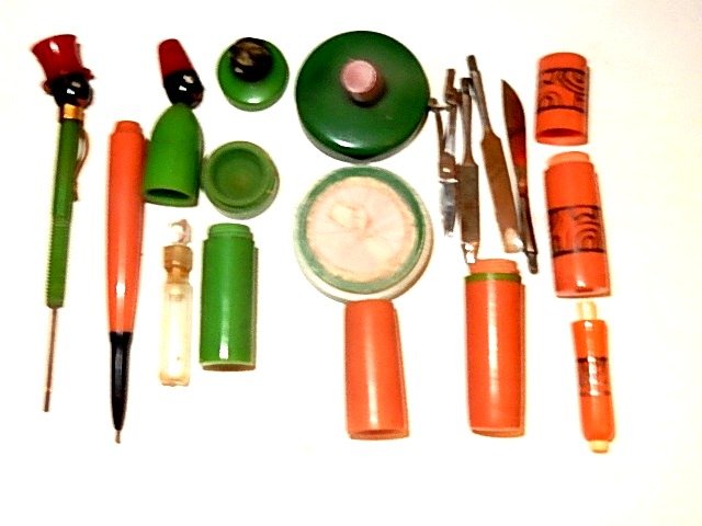 Art Deco Bakelite Ladies Necessity Travel Set: Art Deco multi color ladies dresser vanity or travel set .Bakelite perfume holder of a black figure in red hat. It holds its original glass perfume vial 3 1/4'' long, mini vanity manicure set In Bakel