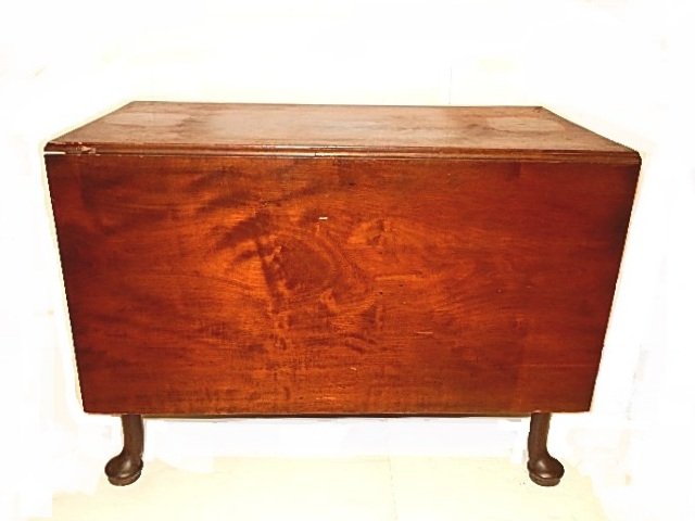 19th. C. English Queen Anne Drop Leaf Table: Made of mahogany wood, drop leafs with swing out leg. Condition apron loose needs new screws, missing section of wood at edge of one drop leaf, one swing leg needs repair at top where fits to table wi