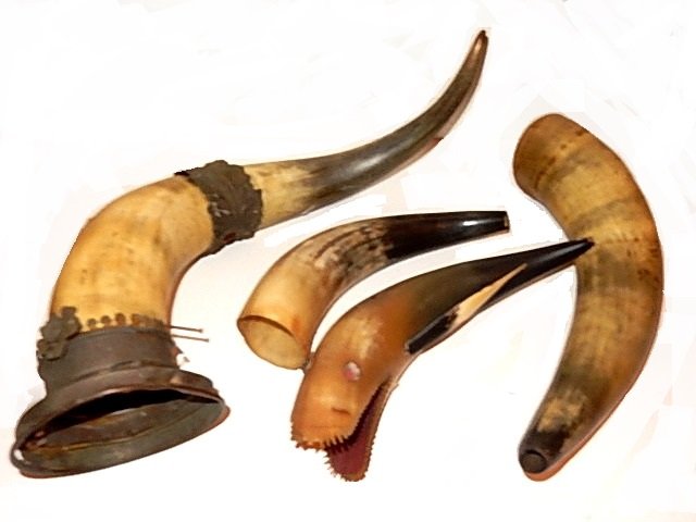 Collection Of Vintage Four Horns: One carved as a shark missing eye, fin and chipped teeth, one powder horn metal rough and not complete, with two other. Powder horn 17'' long, fish 12'', others 10'' & 13'' long.
