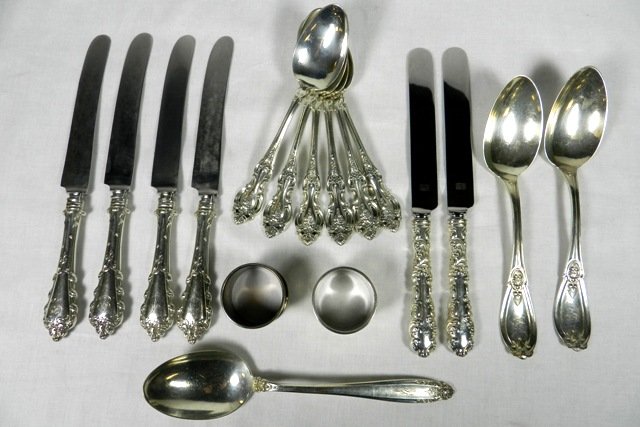Group of 17 Sterling Silver Spoons, Napkin Rings, and: Various makers, patterns, and sizes. Set of 4 butter knives, set of 2 Sheffield butter knives, set of 6 Wallace soup spoons, two plated napkin holders, and 3 international sterling serving spoons. Wei