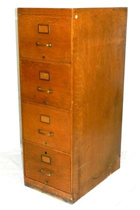 Globe-Wernicke Four Drawer Filing Cabinet: Golden oak 4 drawer file cabinet, with metal interior drawers. Normal use and wear, with some visible wear to finish areas as shown and noted in photos. H 52.5" x 18" x 28".