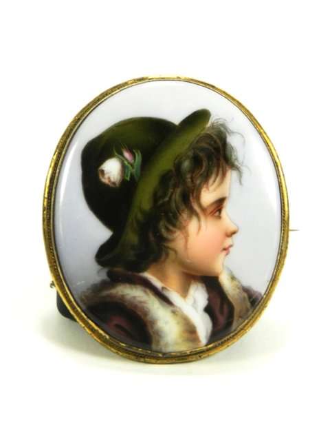 1876 Hand Painted Porcelain Brooch: Hand painted, oval, porcelain brooch displaying an adolescent male in hate and fur vest, with case, signed "Fredericktown, Ohio 1876." h 2 1/2". Overall good condition.