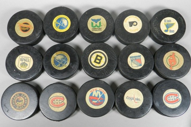 Lot of Seventeen Vintage Viceroy Hockey Pucks: Lot of seventeen (17) vintage viceroy hockey pucks. Teams including Detroit Red Wings, Philadelphia Flyers, Sabres, Hartford Whalers, Canucks, St. Louis Blues, and more.