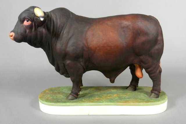 Royal Worcester 'Santa Gertrudis Bull' Porcelain Figure: Royal Worcester porcelain animal figurine, 'Santa Gertrudis Bull,' modelled by Doris Lindner, made especially for Nieman Marcus, model number 47, copyright 1961. H 7 1/2" x W 11". Like new condition,