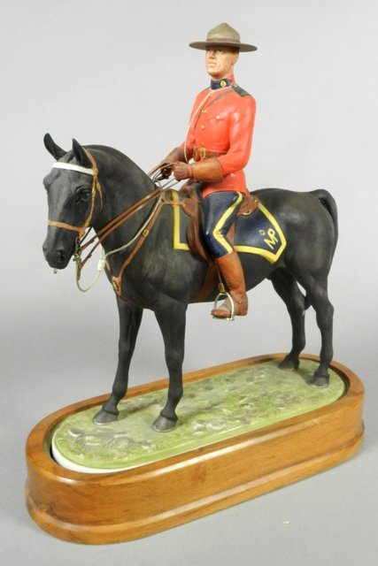 Royal Worcester 'Royal Canadian Mounted Policeman': Royal Worcester porcelain figurine, 'Royal Canadian Mounted Policeman,' modelled by Doris Lindner, copyright 1966, with stand. H 12" x W 11". Like new condition, no chips or cracks.