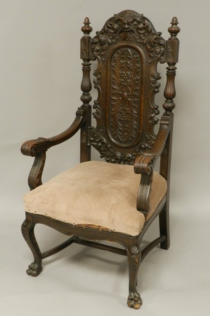 Victorian Oak North Wind Face Arm Chair: Turn of the century Victorian 1/4 sawn oak arm chair, excellent hand carved with North Wind face head rest, hairy paw feet, tan upholstery in good condition. H 48 1/2" x W 26" x D 22". Excellent condi