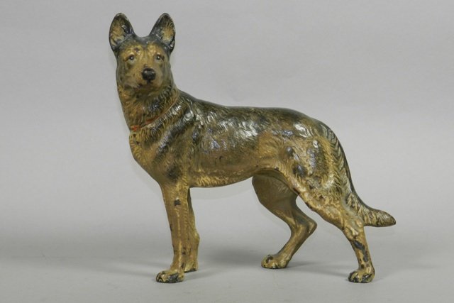 Hubley Cast Iron German Shepherd Doorstop: Attributed to Hubley, unmarked, painted cast iron doorstop, German Shepherd form. H 9 1/2" x L 10". Minor wear and tear, chipped paint throughout. Items from the John Black estate of Mansfield Ohio.