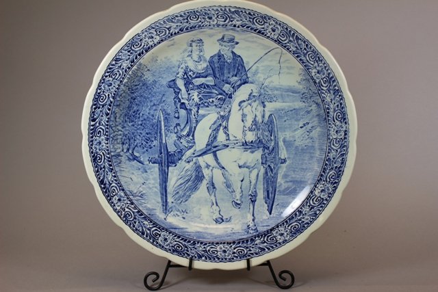 Royal Sphinx Delfts Charger by Bochy Belgium: 16" Charger features a scene of older couple of drawn carriage ride conversing. Mid 20th century. Good condition as shown.