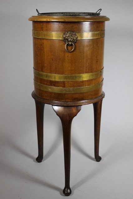19th Century English Regency Barrel Wine Cooler: Stately, yet Elegant 19th Century English Barrel Wine Cooler on a tripod queen Anne style leg, brass strap decorations with three lion head ring accents as well. Removable tin & zinc liner with two ri