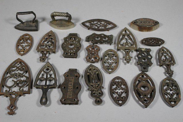 Group of 20 Miniature Cast Iron Trivets & Sade Iron: Normal use and wear. Approx. Ranging from 3 to 7 inches.