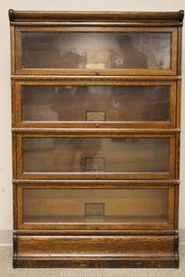 Globe Wernicke Four Stack Oak Bookcase: All original four stack oak bookcase, iron strap sides, dress base, Globe Wernicke company of Cincinnati, Oh. Model D/8.5 H 53" x W 34" x D 12". Overall condition very good.