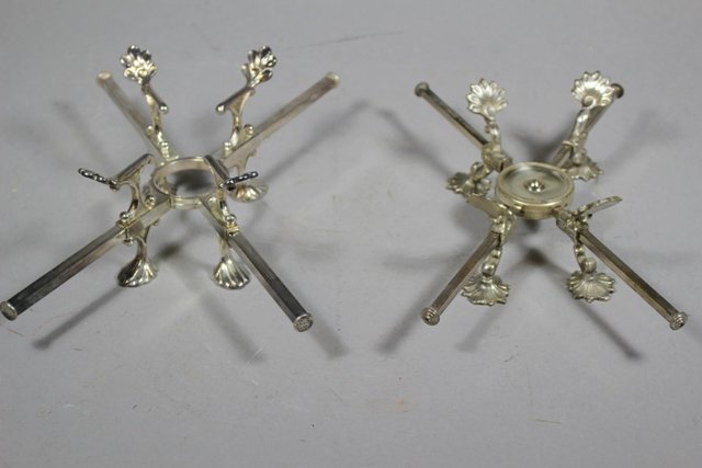 2 Adjustable Footed Bowl Trivets: Silver plated footed bowl stands or trivets. Adjustable in sizes. Normal use and wear.