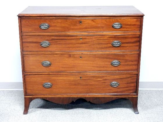 19th Century Mahogany Four Drawer Chest: Slightly splayed legs, scalloped apron, lower string inlay, original oval hardwear and key locks, old refinish, ogee molded top. H 38" x W 42" x D 20". Age appropriate.