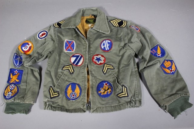 THE COMBAT JACKET by Harle: Youth/Child bomber jacket with original patches. Note some fade and wear to cuffs as shown.