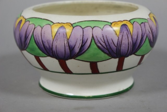 Early Roseville Persian Pottery Jardiniere: Early Roseville Pottery, USA, persian pottery line, unmarked. Hand painted ceramic jardiniere, purple flower design. H 4" x D 7 1/2". Overall good condition, minor paint loss, crazing seen on bottom.