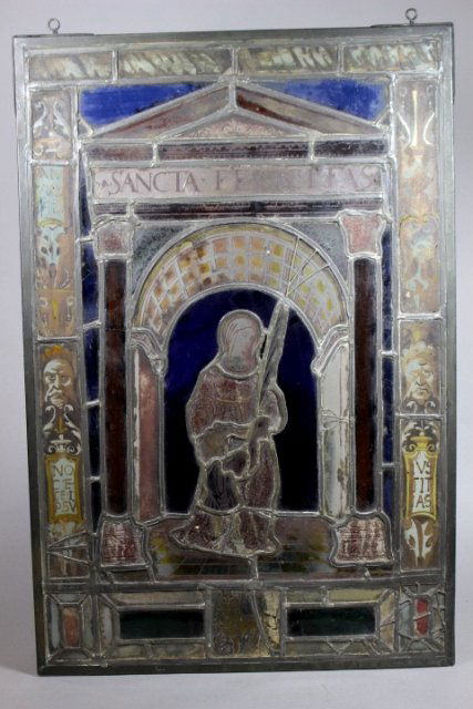 19th Century Stained Glass Window (Sancta Felicitas): Italian religious stained glass window, probably late second half of 19th century. Note: stained and painted glass, some fading to the painting. Standing 25" tall by 16.75" wide. Property of the Willi