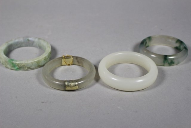 Four 20th century Chinese Carved Jade Bracelets (1 of 6)