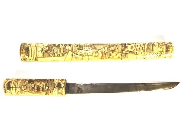 19th Century Japanese Meiji Period Wakizashi: Antique Japanese Meiji period Wakizashi (shorter of the two Samurai swords, Katana being the long sword and together word for battle) sword, having a bone saya and tsuka covered in carved relief scene