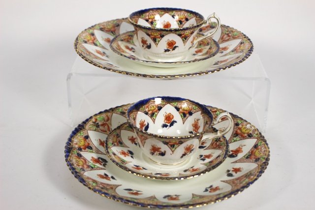 Samuel Radford Porcelain Pieces in Lotus Pattern: Six pieces of Samuel Radford, England, porcelain in the Lotus pattern, all marked on bottom with dark red stamp. Includes: two dishes, two cups and two saucers. Dishes D. 9", cup H. 2", saucer D. 5.5"