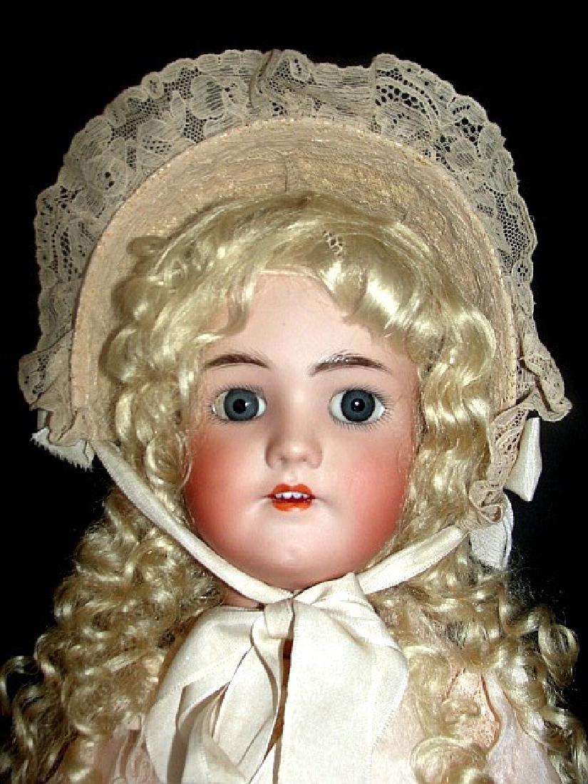 Heinrich Handwerck / Simon & Halbig Doll 21'': Germany bisque head doll with blonde curly new- wig marked 2 1/4, with W at the top of forehead, bright blue sleepy eyes, open mouth with teeth, painted brows and upper and lower lashes, Earrings, com