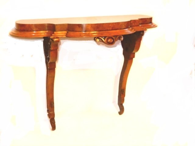 Victorian Carved Clock Shelf: Wonderful assembled clock shelf or just a nice shelf bracket. with burled veneer top and shaped arms. H. 28'' W. 32'' D. 11''. Condition very good there;s a few light veneer bubbles on top.