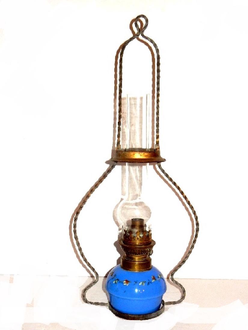 Victorian Hanging Oil Light With Blue Font: Having a twisted wire frame and powder blue font. All original no shade. Frame 22'' tall, font 7'' x 5''