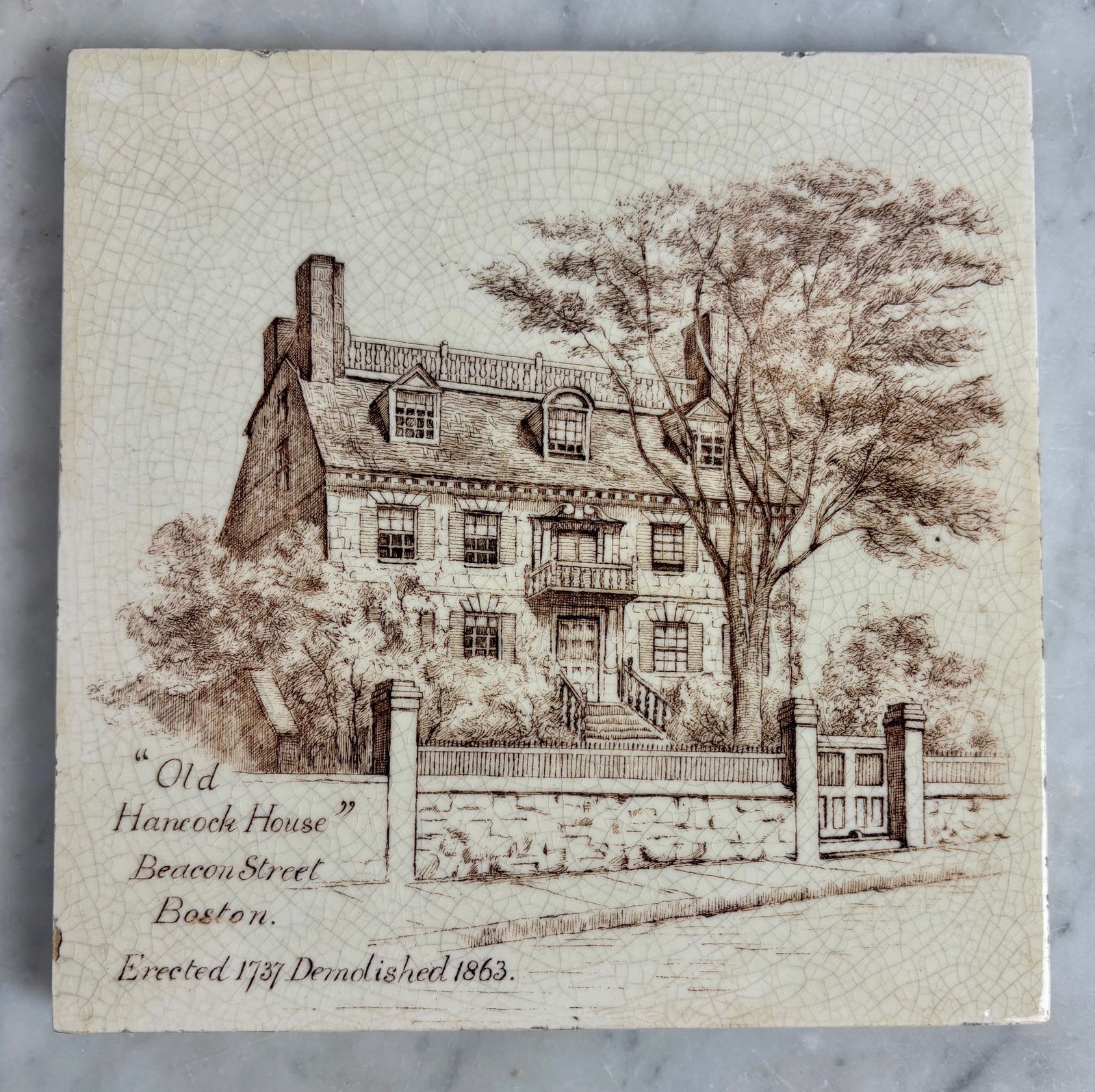 Old Hancock House Art Tile, Beacon Street, Boston, Antique Blue & White: The Minton Souvenir Tile featuring the Old Hancock House on Beacon Street in Boston is a unique collectible item made in England. This souvenir tile showcases a piece of Massachusetts history and is a