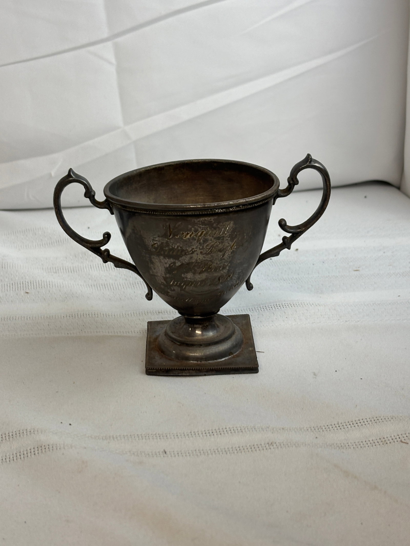 Ladies Singles Tennis Trophy, Nonquitt, Massachusetts, 1899, won by Clara Morgan Rotch: Ladies Singles Tennis Trophy, Nonquitt, Massachusetts, 1899 won by Clara Morgan Rotch Nonquitt is a historic beachfront community in Dartmouth, Massachusetts, known for its salt marshes, coastal scene