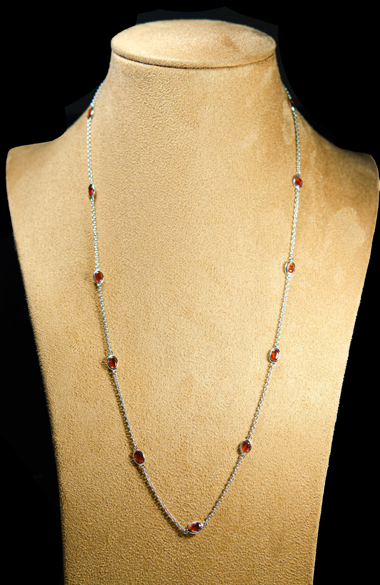 Rhodium-Plated 925 Silver Gem Chain with Garnet Accents: Sterling silver chain with rhodium plating for brilliant shine and tarnish resistance, highlighting vibrant colorful gemstones including rich red garnets for a cool, modern twist. Lightweight yet stri