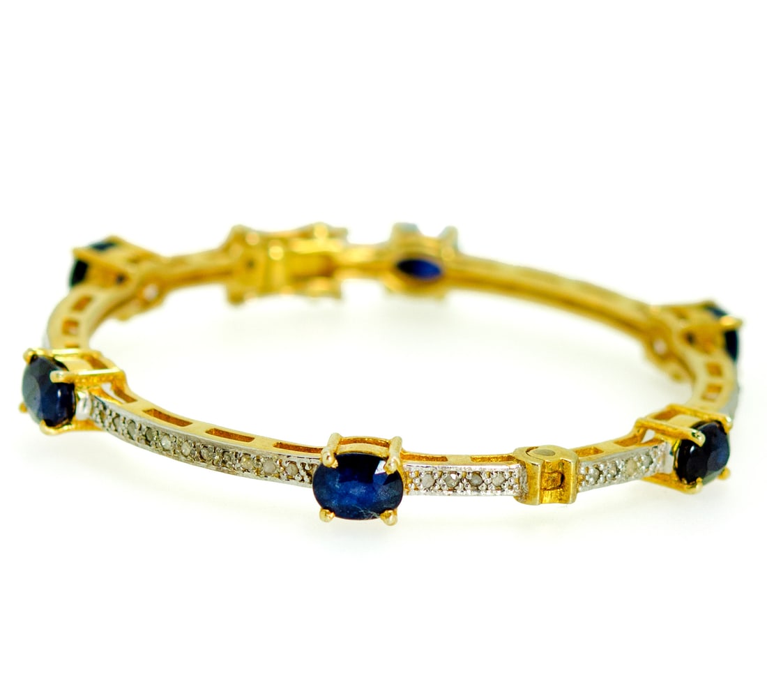 18K Gold-Plated 925 Silver Bracelet with Blue Sapphire: 18K Gold-Plated 925 Silver BraceletPolished 18K gold-plated 925 silver bracelet with smooth links, giving a sleek golden look at a more accessible price than solid gold with sappahie surrounding the i
