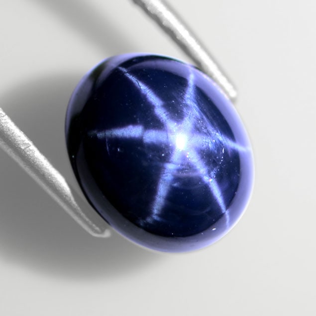 6.56 Cts Stunning Star Sapphire: Breathtaking 6.56 carat star sapphire with vivid 6-ray star effect and superior flash, showcasing deep cornflower blue saturation. Ideal for high-end jewelry.