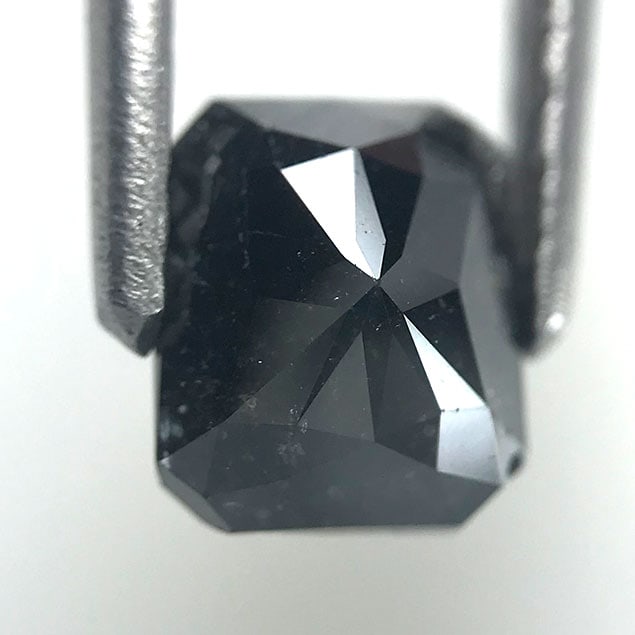 1.40 Cts Natural Black Diamond: Authentic 1.40 carat natural black diamond with deep opacity and high polish, perfect for modern designs.
