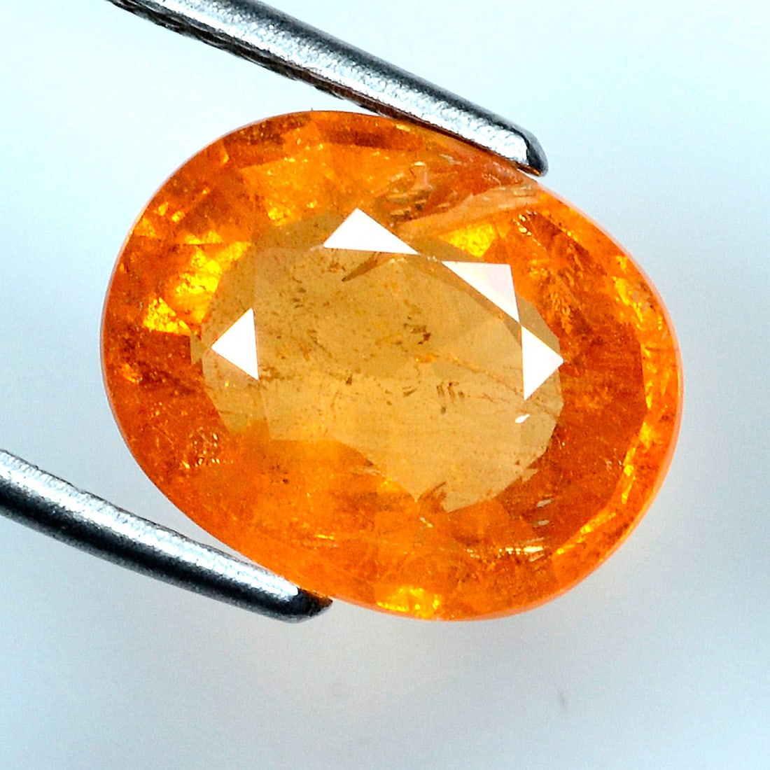 6.84 Cts IGI certified Spessartite Garnet: Vibrant 6.84ct IGI-certified spessartite garnet with intense orange-red saturation.