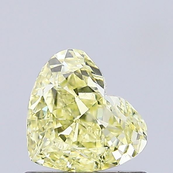 0.59 Lab Grown Diamond FANCY INTENSE YELLOW HEART Shape: An elegant a 0.59 ct lab-grown diamond in Fancy Intense Yellow, cut with a romantic heart silhouette. Crafted to elevate a three-stone ring, this stone delivers rich color depth with strong visual pre