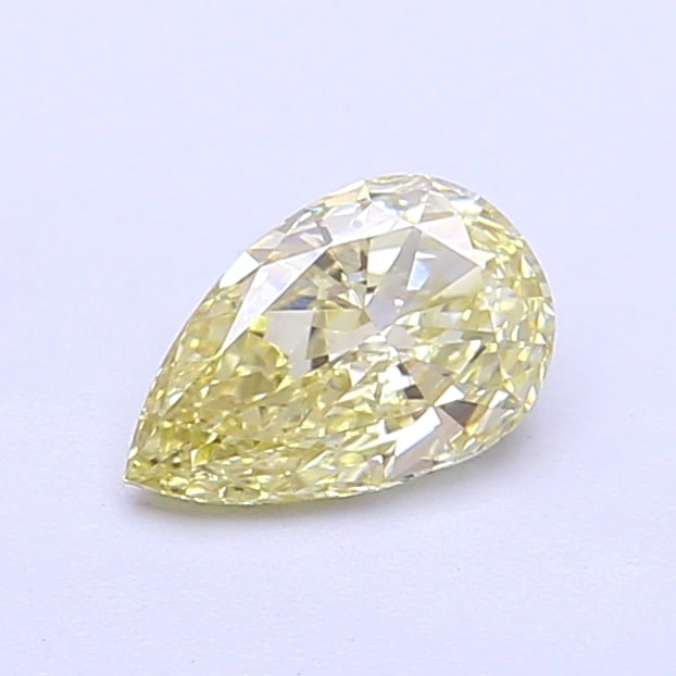 0.59 Lab Grown Diamond FANCY YELLOW PEAR Shape: A striking a 0.59 ct lab-grown diamond in Fancy Yellow, cut with an elongated teardrop silhouette. Perfect for a modern bespoke piece, this stone delivers a pleasing color presence with bright life an