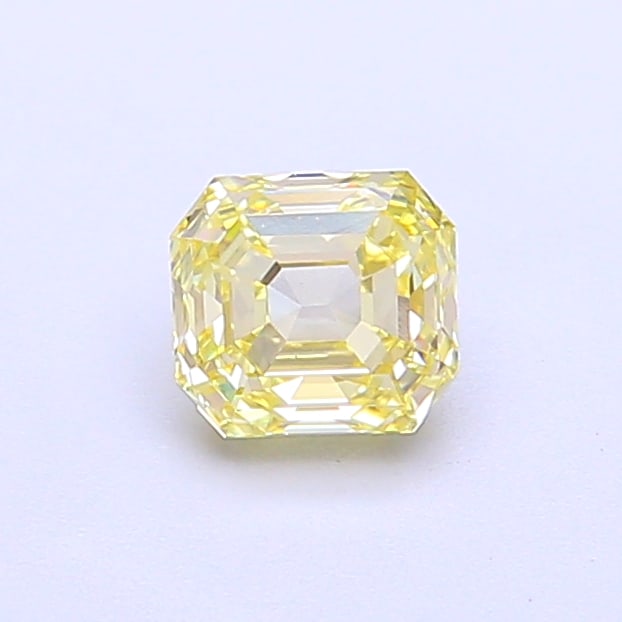 0.63 Lab Grown Diamond FANCY INTENSE YELLOW ASSCHER Shape: A refined a 0.63 ct lab-grown diamond in Fancy Intense Yellow, cut with a bold square step-cut look. Well-suited to a statement ring, this stone delivers rich color depth with strong visual presence a