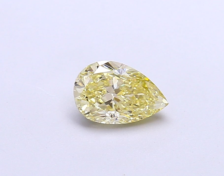 0.64 Lab Grown Diamond FANCY INTENSE YELLOW PEAR Shape: A captivating a 0.64 ct lab-grown diamond in Fancy Intense Yellow, cut with a graceful teardrop profile. An excellent pick for a pendant, this stone delivers rich color depth with strong visual presen