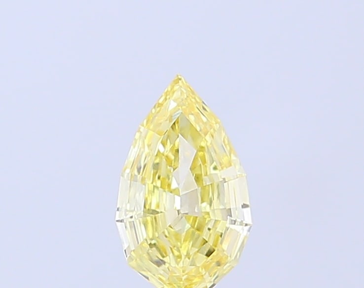 0.64 Lab Grown Diamond FANCY INTENSE YELLOW GEO PEAR CUT Shape: Showcasing a 0.64 ct lab-grown diamond in Fancy Intense Yellow, cut with a contemporary geo pear profile. Ideal for a solitaire ring, this stone delivers rich color depth with strong visual presence a