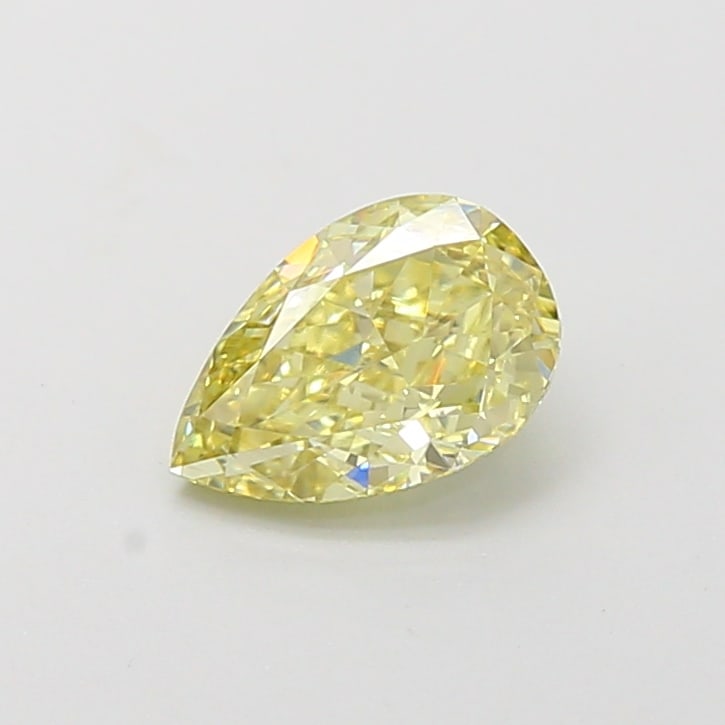 0.73 Lab Grown Diamond FANCY VIVID YELLOW PEAR Shape: A beautifully crafted a 0.73 ct lab-grown diamond in Fancy Vivid Yellow, cut with a classic pear outline with a tapered tip. Designed for a vintage-inspired design, this stone delivers high-saturation