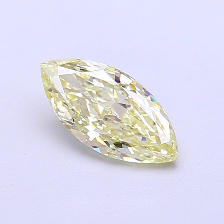 0.75 Lab Grown Diamond FANCY LIGHT YELLOW MARQUISE Shape: Showcasing a 0.75 ct lab-grown diamond in Fancy Light Yellow, cut with a sleek marquise profile. Ideal for a solitaire ring, this stone delivers a soft, luminous tone with a refined glow and a clean,