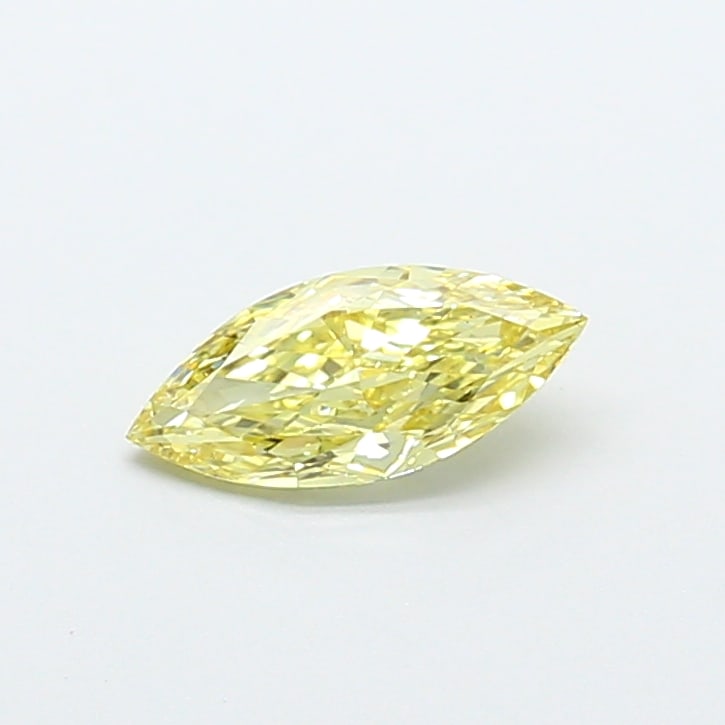 0.76 Lab Grown Diamond FANCY YELLOW MARQUISE Shape: Offered here is a 0.76 ct lab-grown diamond in Fancy Yellow, cut with a marquise silhouette that looks larger face-up. Ready to set in a halo setting, this stone delivers a pleasing color presence wit
