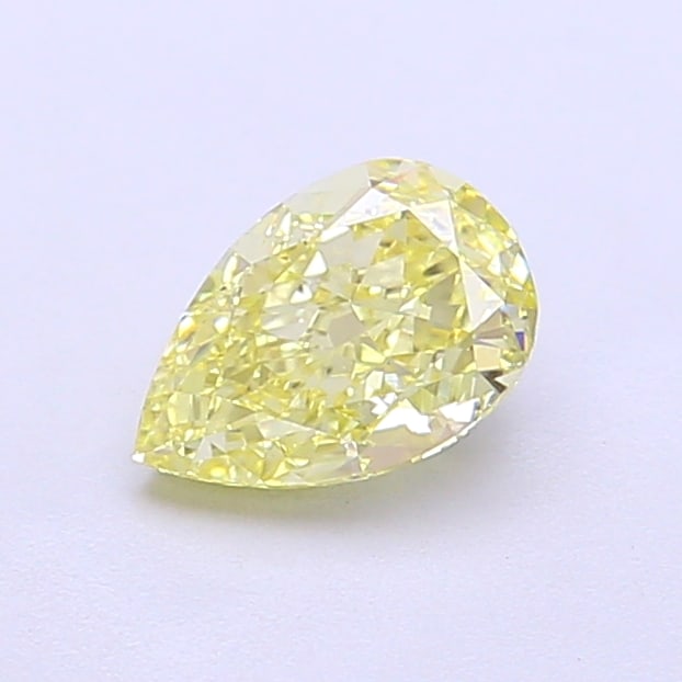 0.78 Lab Grown Diamond FANCY INTENSE YELLOW PEAR Shape: An elegant a 0.78 ct lab-grown diamond in Fancy Intense Yellow, cut with a graceful teardrop profile. Crafted to elevate a three-stone ring, this stone delivers rich color depth with strong visual pre