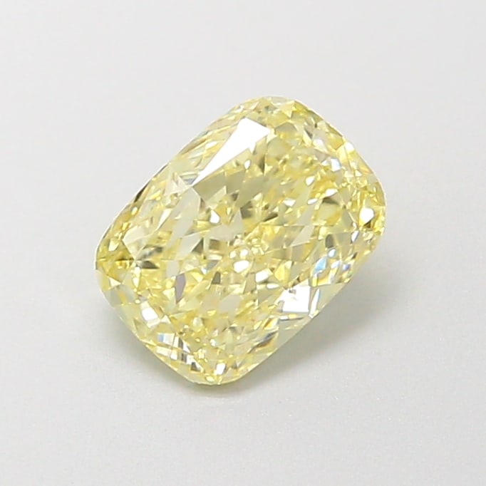 0.78 Lab Grown Diamond FANCY LIGHT YELLOW CUSHION Shape: A striking a 0.78 ct lab-grown diamond in Fancy Light Yellow, cut with a pillowy cushion silhouette. Perfect for a modern bespoke piece, this stone delivers a soft, luminous tone with a refined glow a